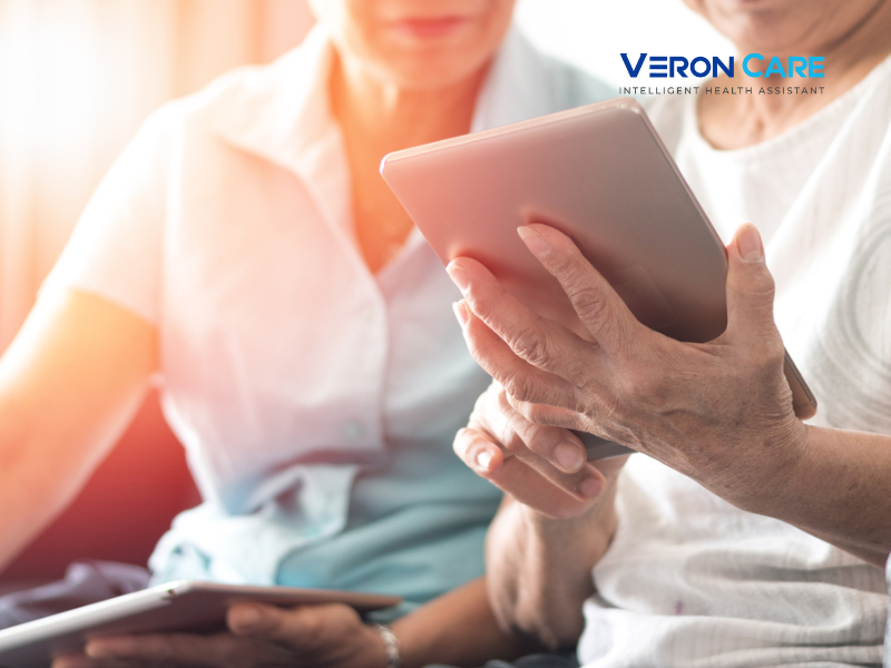 Elderly couple using a tablet to access digital health information at home