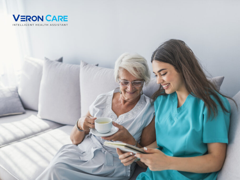Senior woman and home healthcare nurse reviewing health information on a tablet as part of a hospital-at-home care program