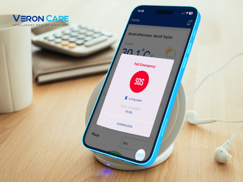 Smartphone displaying automatic fall emergency SOS alert from silent emergency detection system.