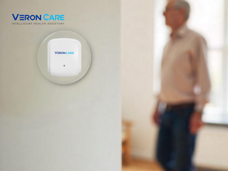 Wall-mounted Veron Care device enabling continuous health sensing while senior moves safely at home.